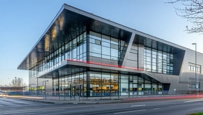 A modern commercial building with large windows an
